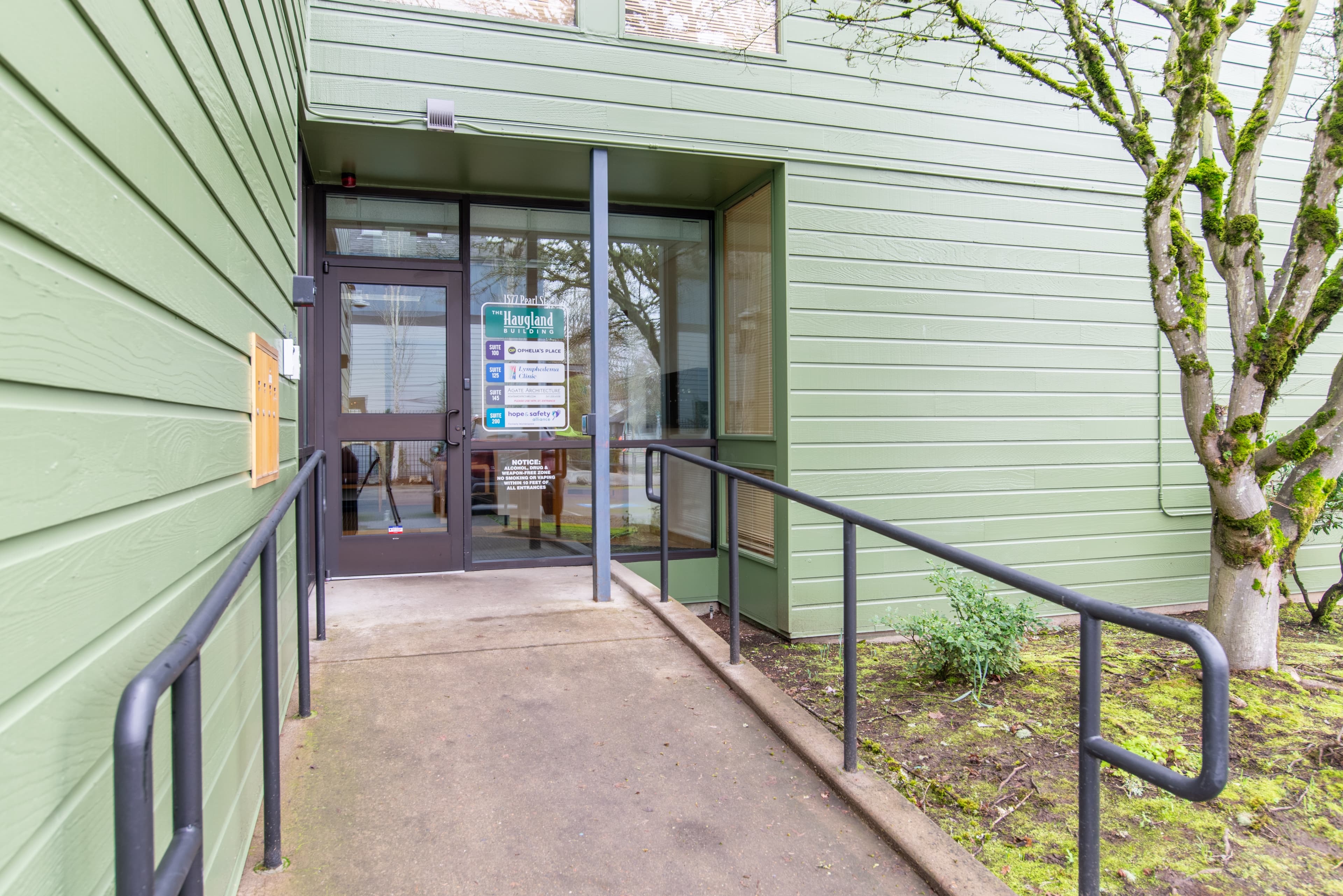 The entrance to the Ophelia Building on Pearl Street is up a slightly inclined ADA ramp, the sign on the window depicts "Turningpoint Lymphedema Clinic" in Suite 125