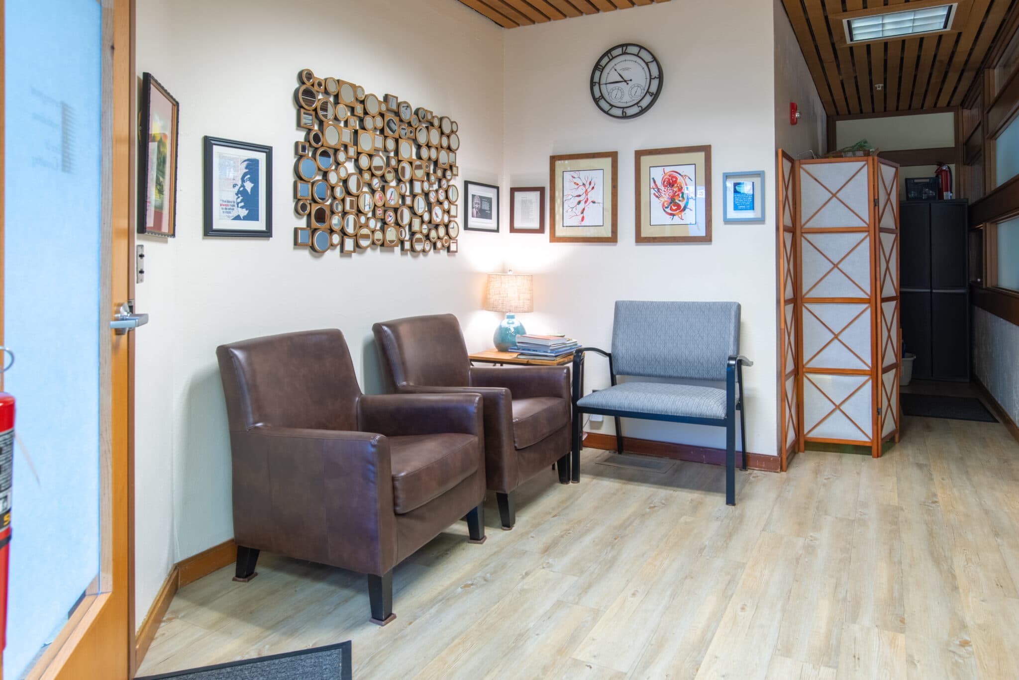 Interior of Turningpoint Lymphedema Clinic shows comfortable chairs, chic wall decor and artwork, including a portrait and quote from Martin Luther King Jr.
